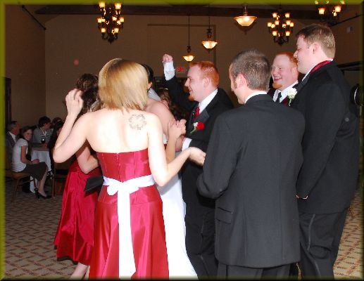 The wedding party joins the dance